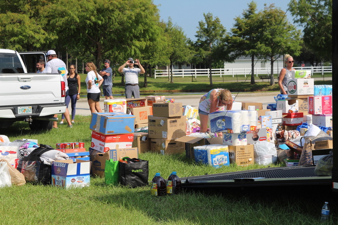 Donations for Volusia for the Bahamas pile up as volunteers haul them onto the trailer. Photo by Tanya Russo