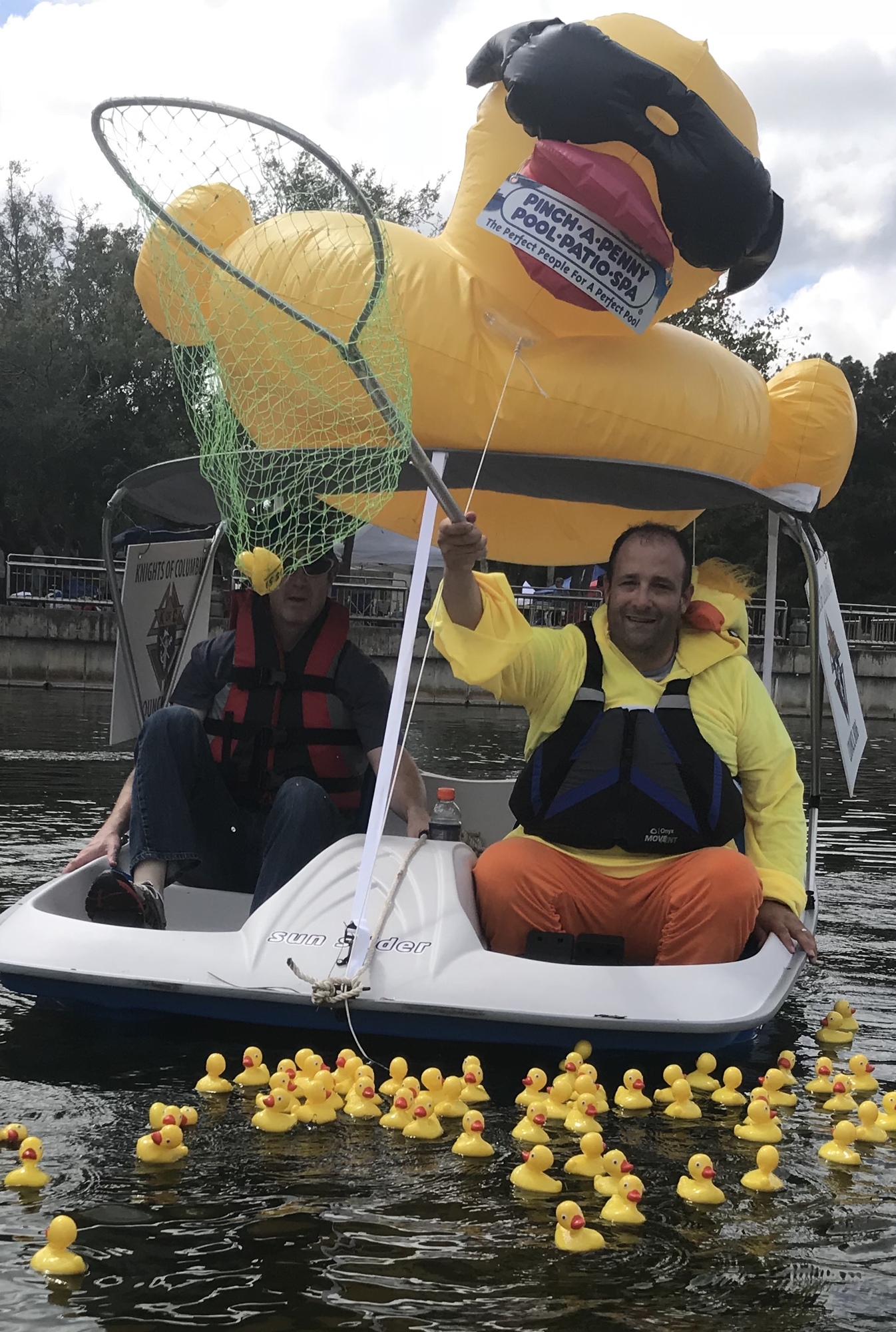 SK Richie Smatt, wearing the duck suit, rescues the winning duck from the Port Orange City Center pond to highlight Council 8086’s third-annual Duck Derby. SK Steve Casserly assisted with the paddling. Courtesy photo