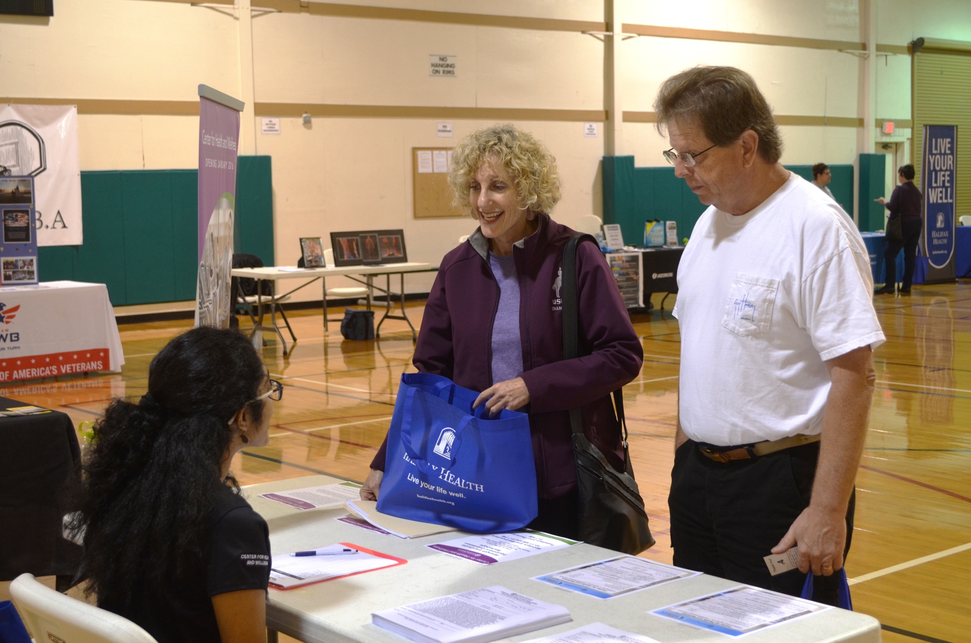 Nancy and Richard Holman get some information.