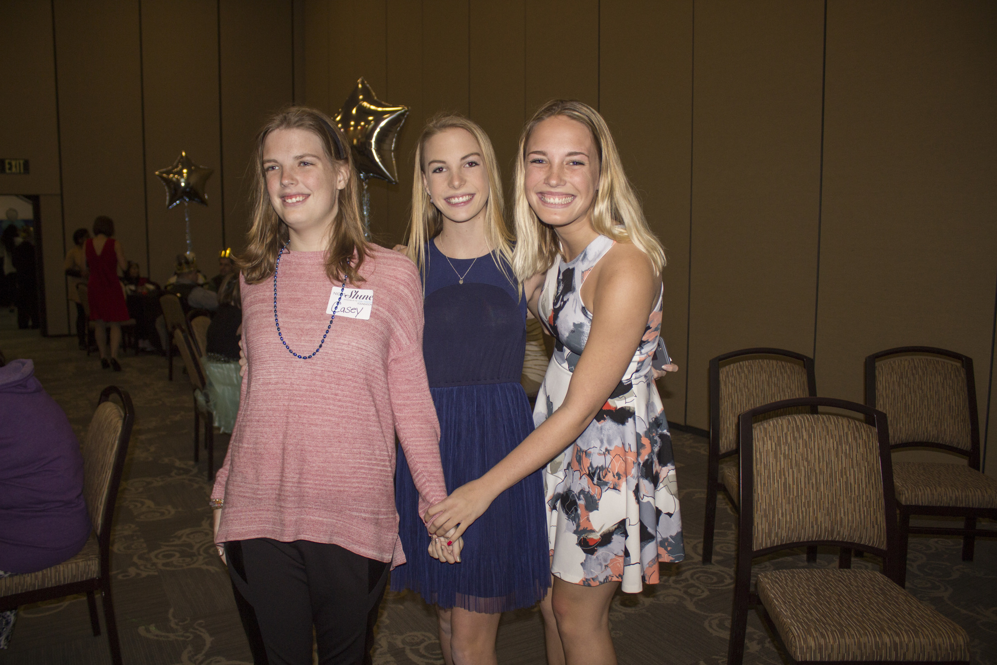 Casey Brock, Mandy Brock, and their older sister, Lindsay Brock, who came down from the University of Florida to be with her sisters at Night to Shine.