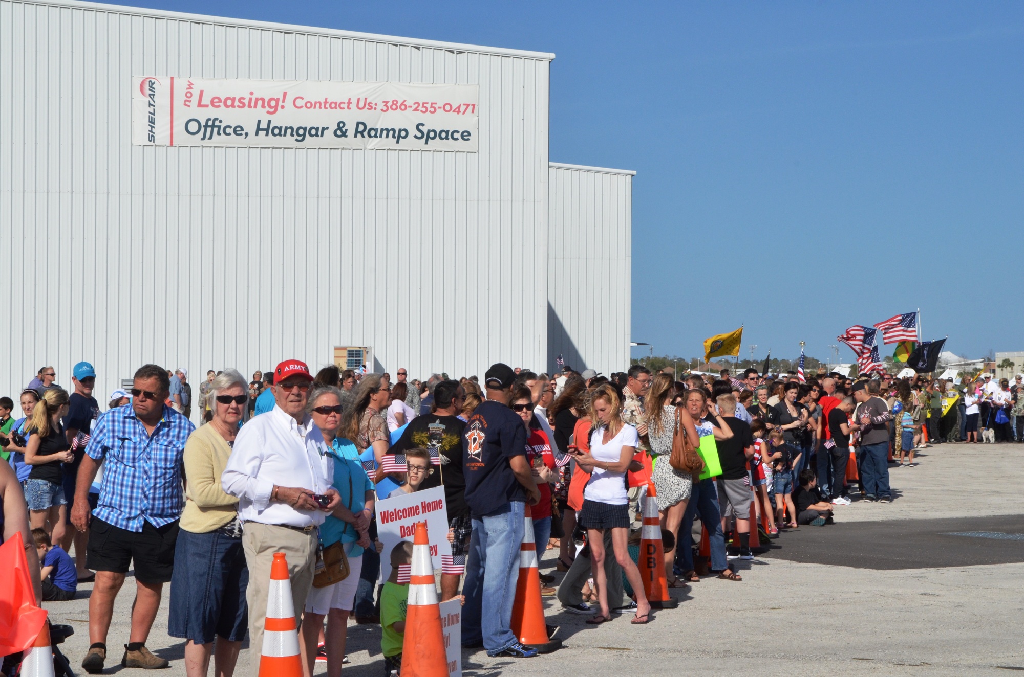 Parents, wives and friends await the returning troops. Photos by Wayne Grant