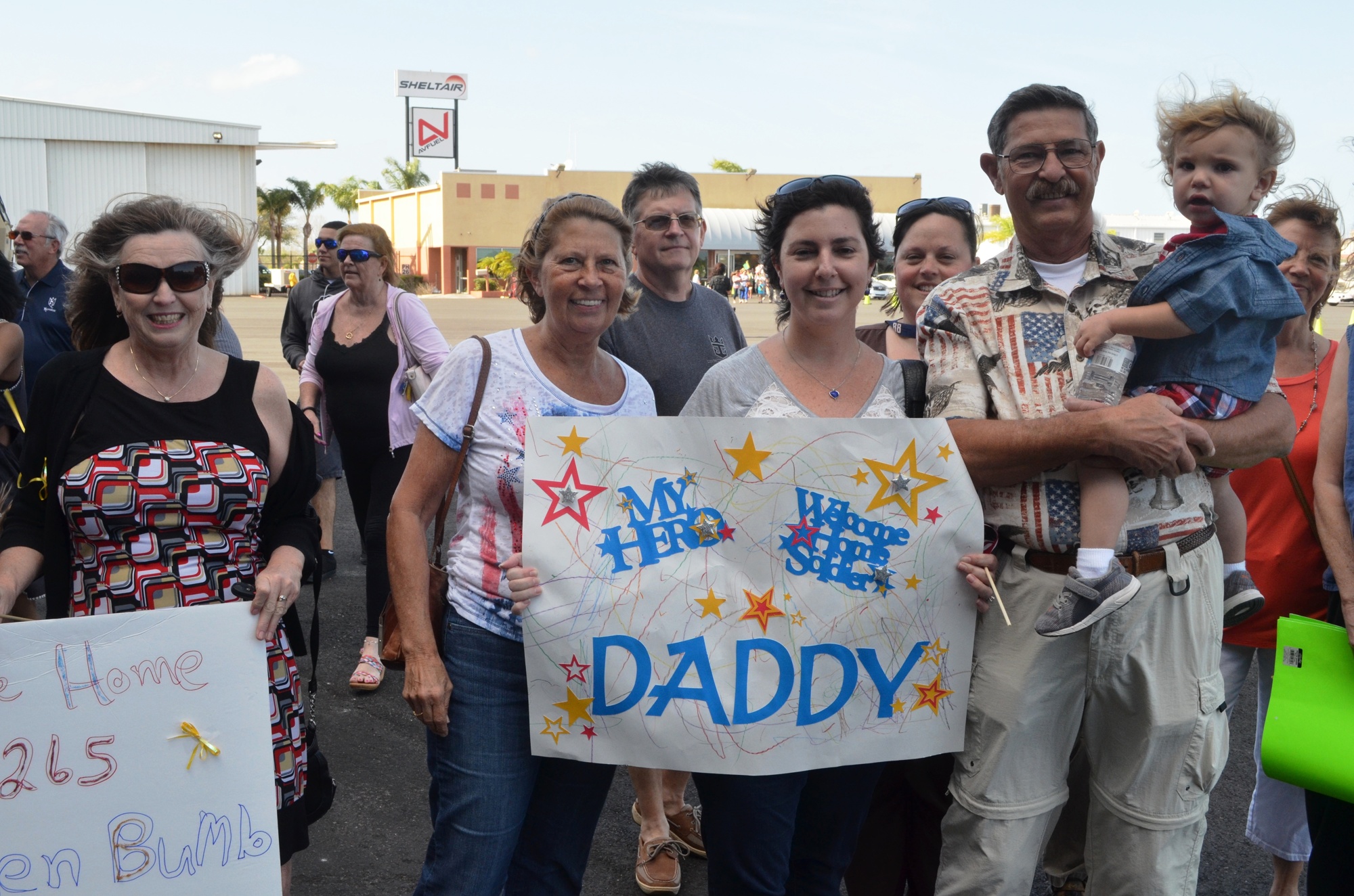 Bonnie, Melana and Les Bumb wait for their returning soldier.