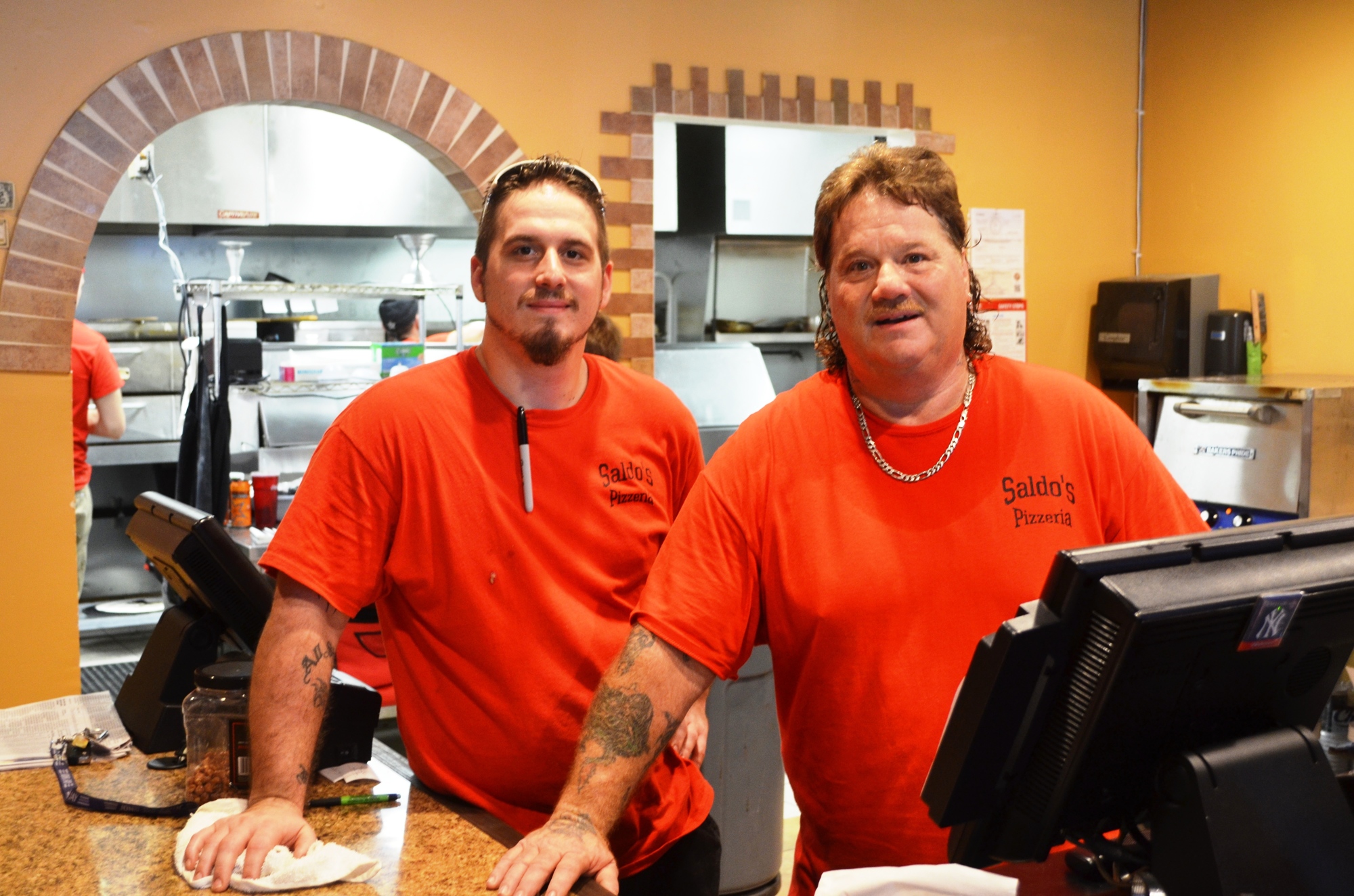 Shawn and his dad, Steve, make authentic New York pizzas at their new restaurant. Shawn’s brother Steve, Jr., will soon join them.