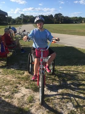 Allacyn Beebe, 19, on her favorite pink bike (Photo by Emily Blackwood)