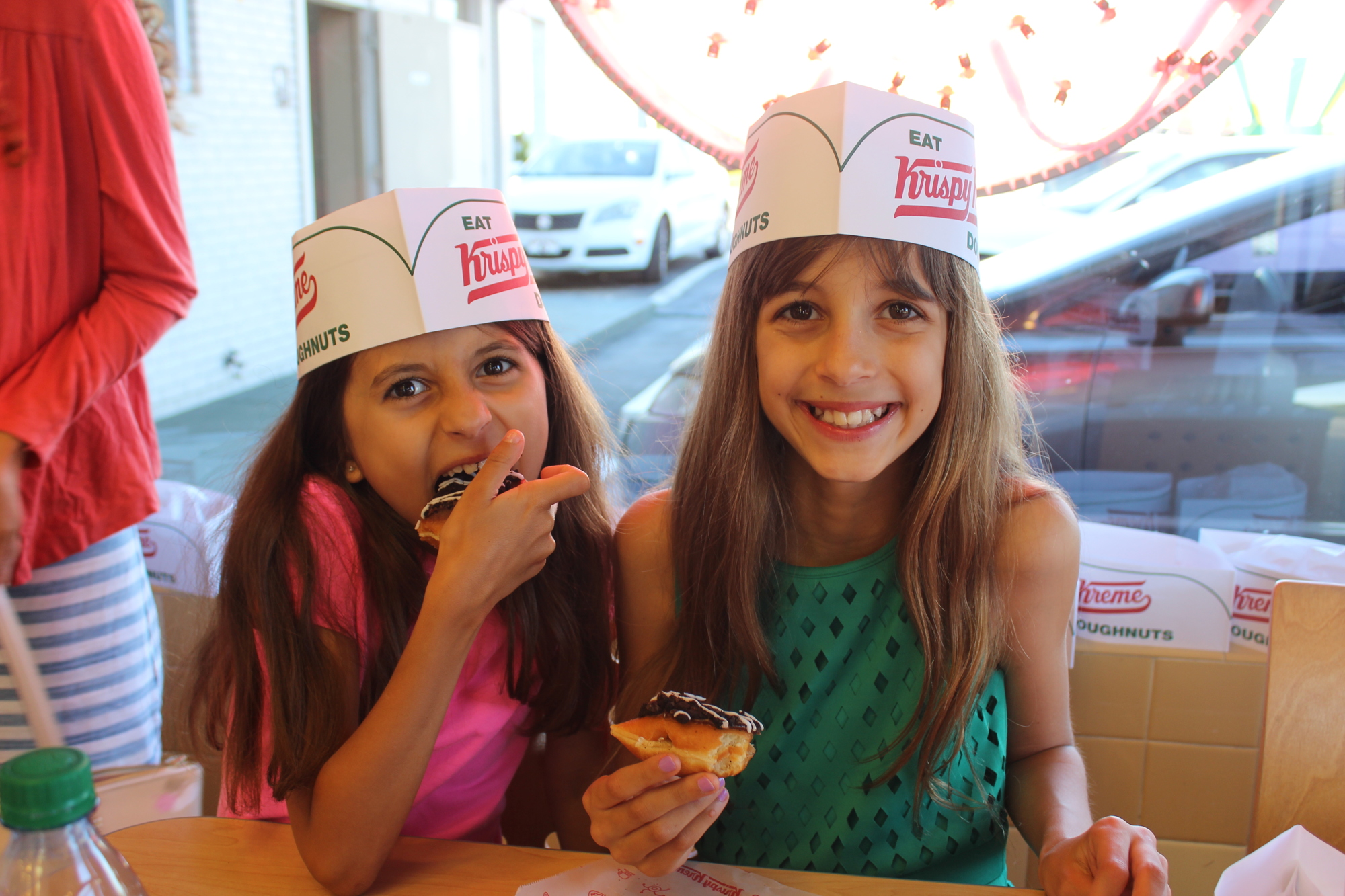Eva Manley, 8 and Lola Manley, 9 wasted no time sampling the donuts.