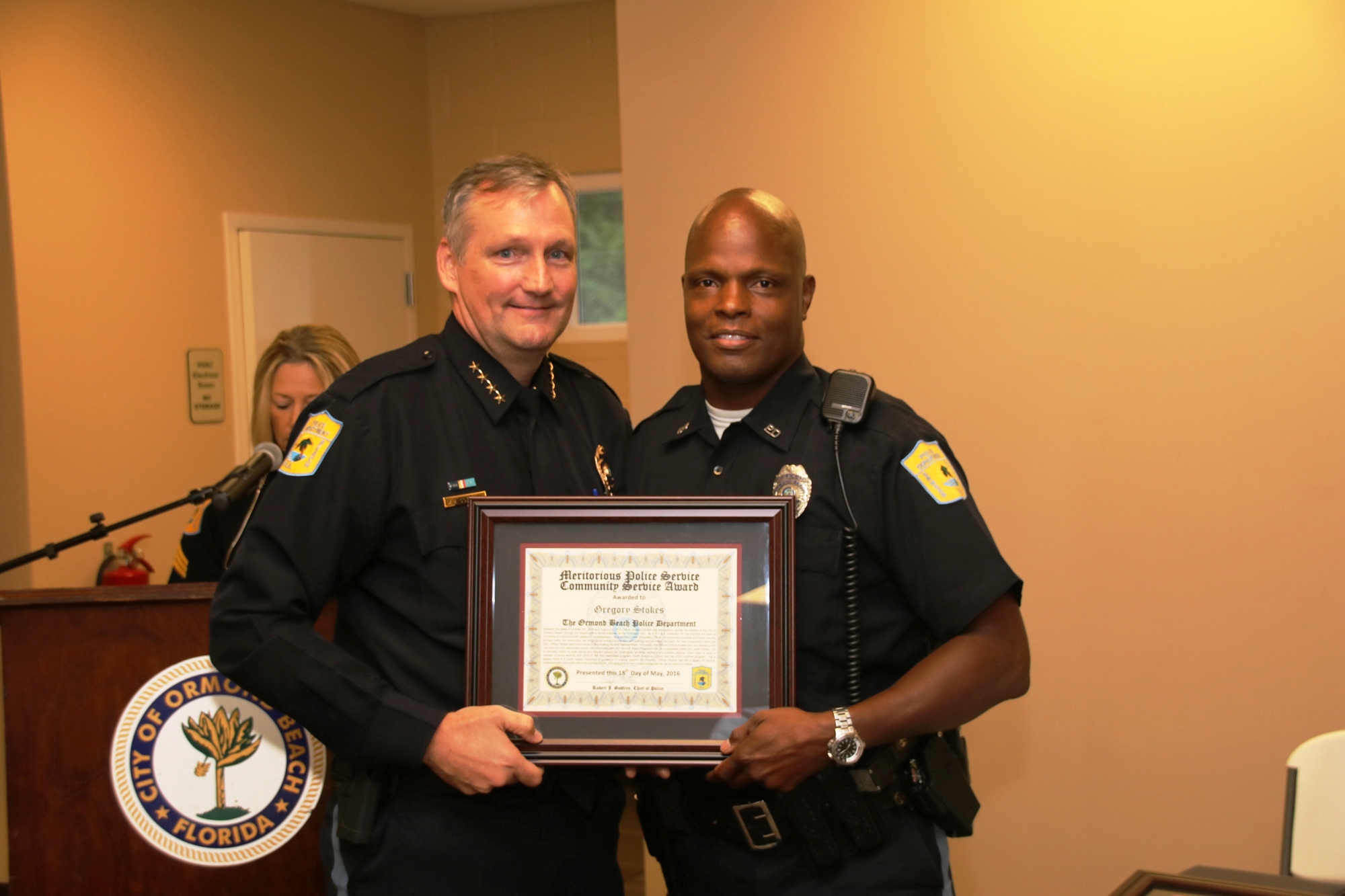 Chief Jesse Godfrey presents an award to Officer Gregory Stokes. Courtesy photos