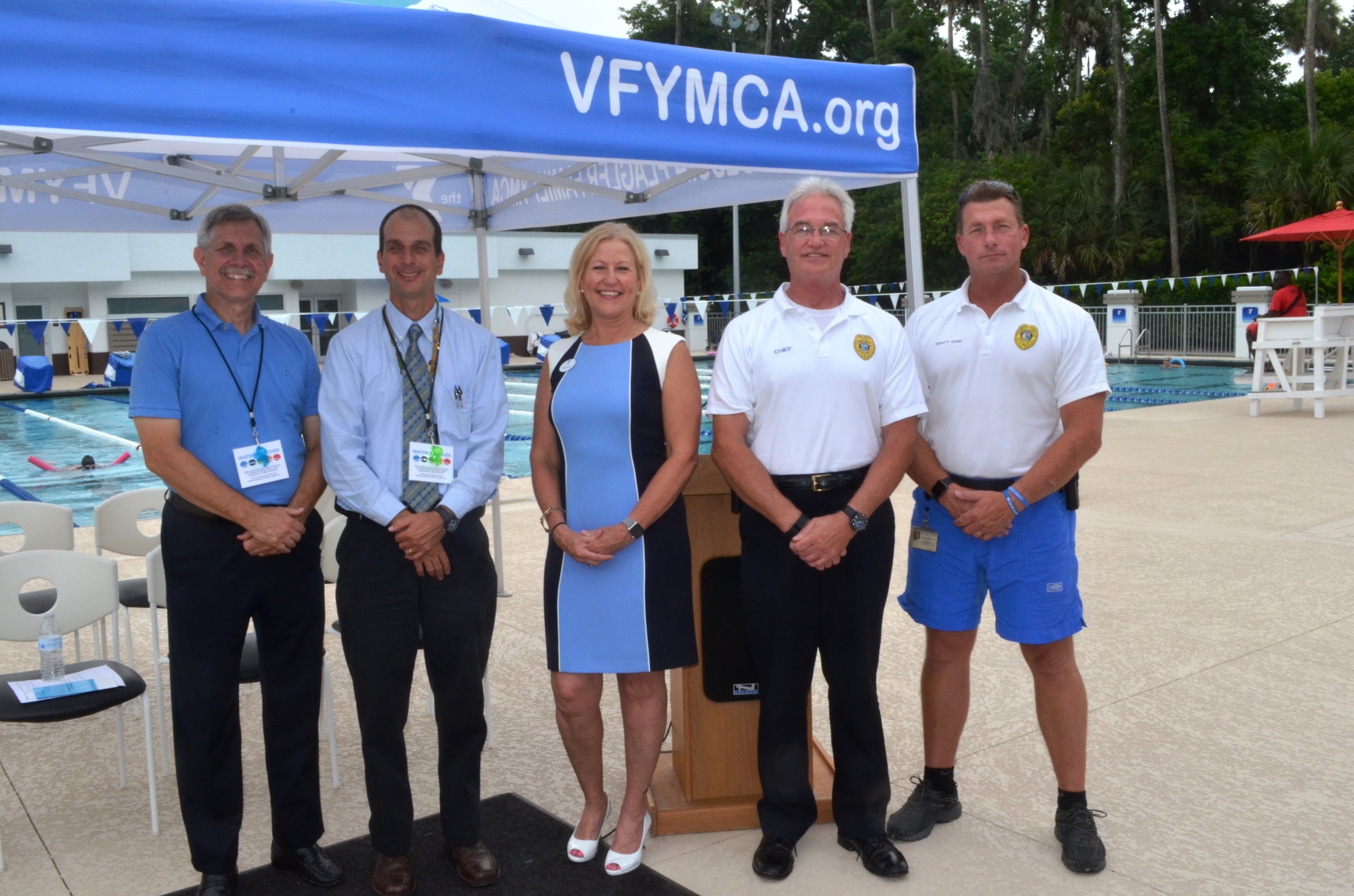 Shown are Steve Parris, Halifax Health; Eric Maday, Florida Dept. of Health; Teresa Rand, YMCA president and CEO; Mark Swanson, director of Beach Services; and Deputy Chief Ray Manchester, Beach Patrol.