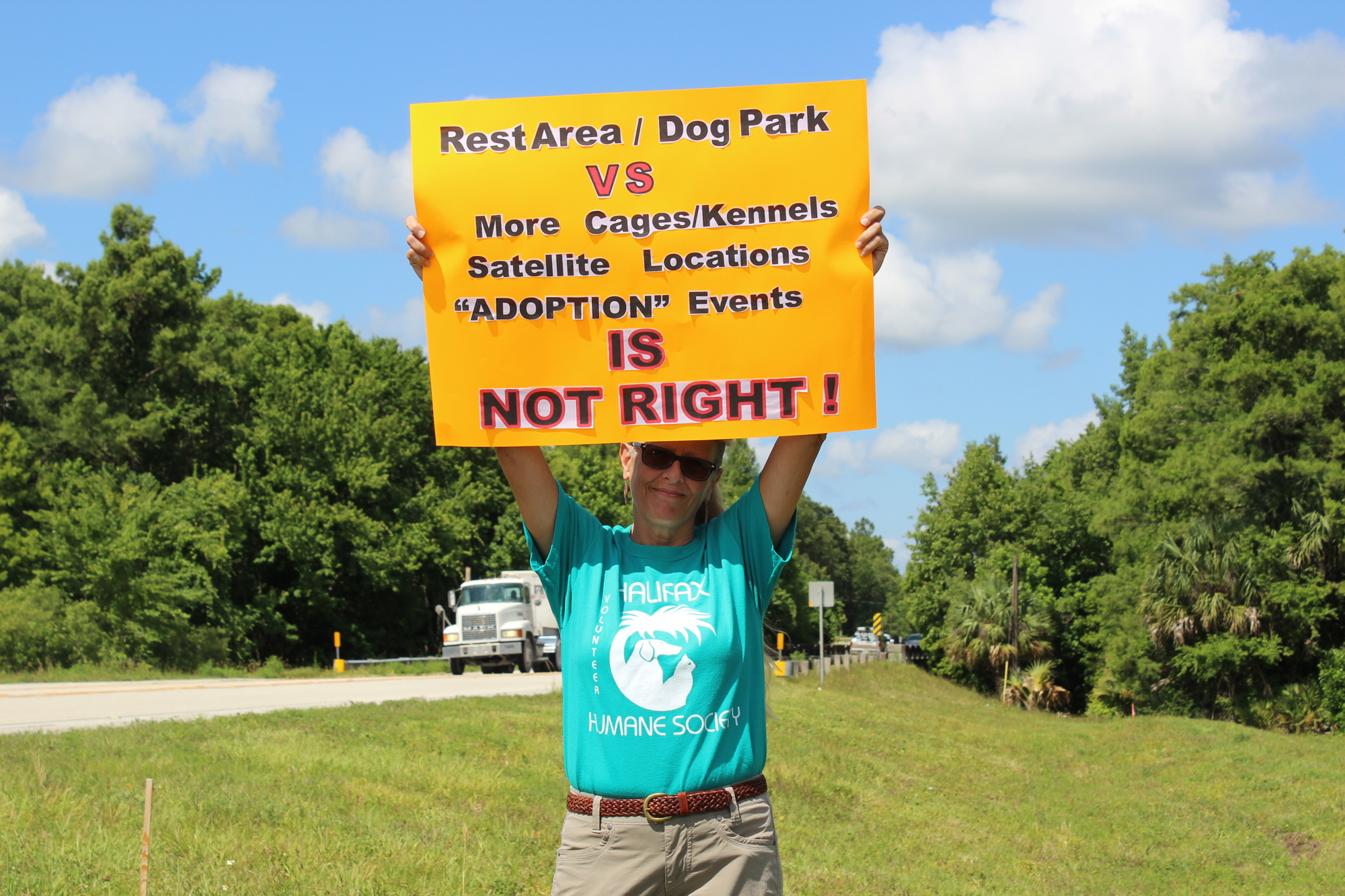 Tammy Wozniak, an ex-volunteer and former employee, stood outside HHS and protested during the event.