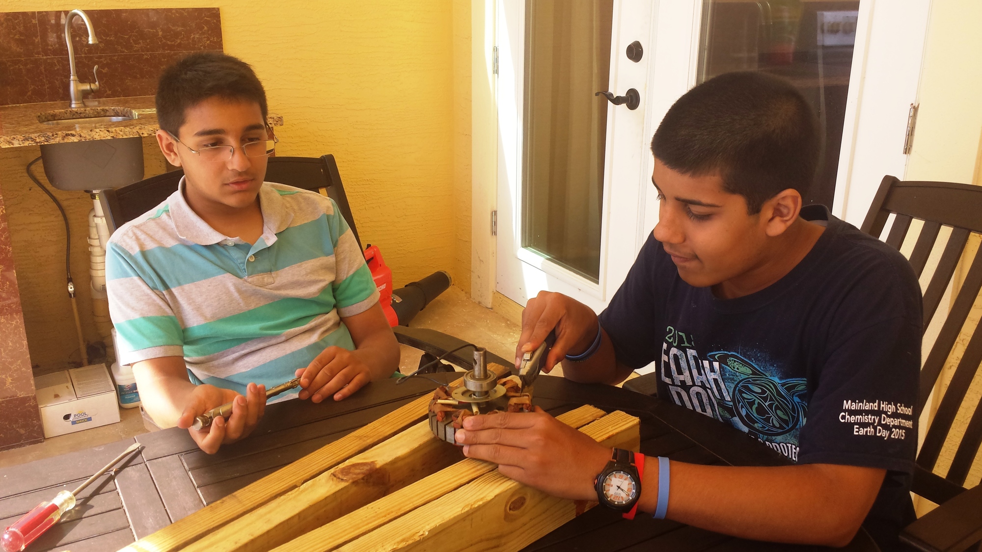 Jash and Miraj Patel work on their wind turbine for in international science contest.Courtesy photo