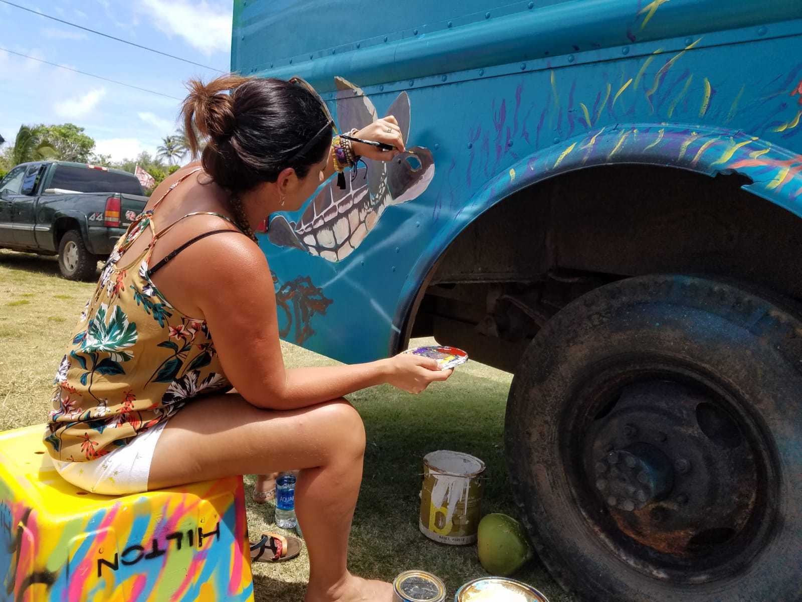 Thays Franca paints a turtle on a food truck while on her visit to Hawaii. Courtesy photo