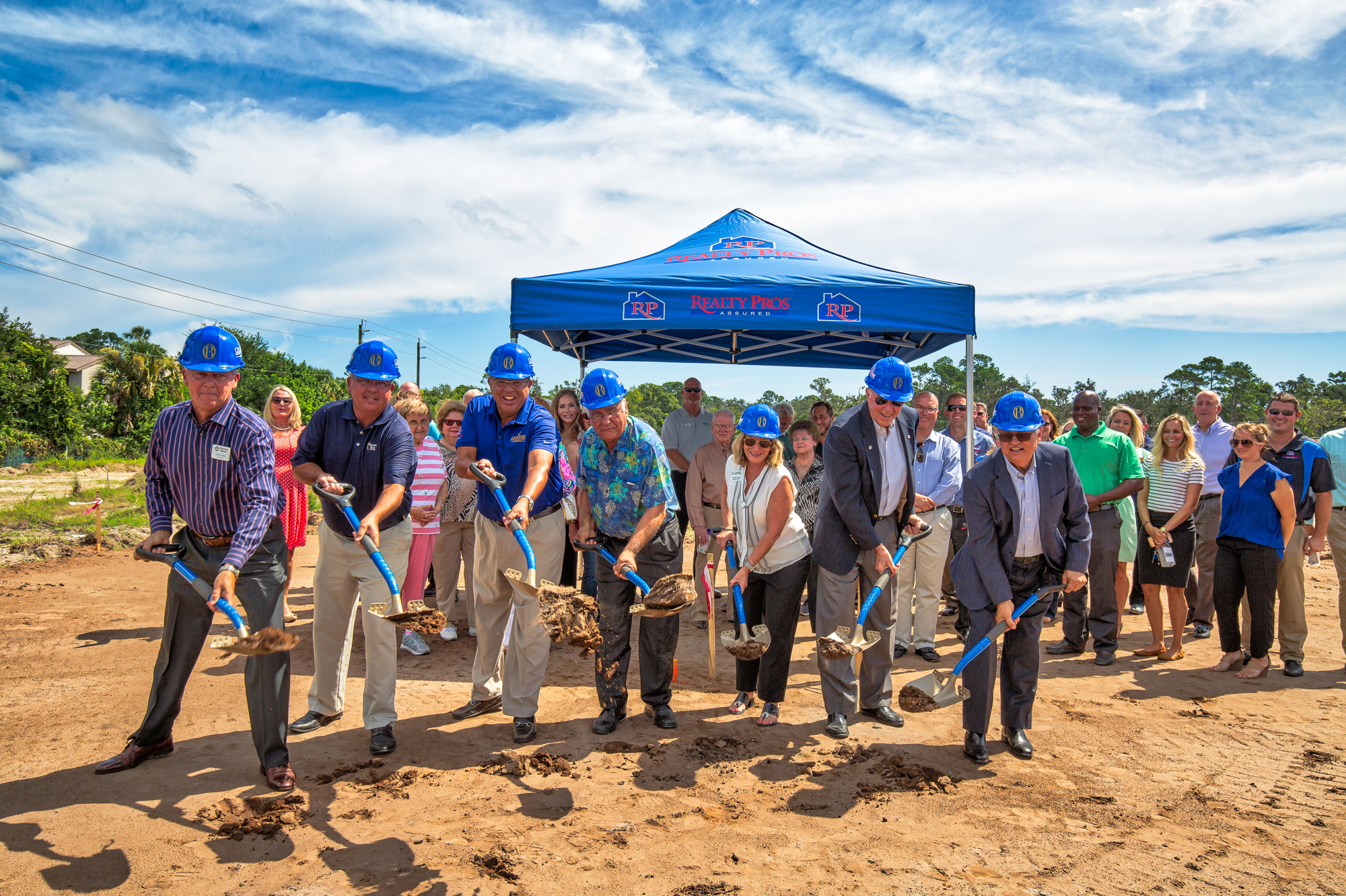 Officials toss dirt on Aug. 30 to begin construction of the first condos at Ormond Renaissance Condominiums. Courtesy photo by Katy Beals