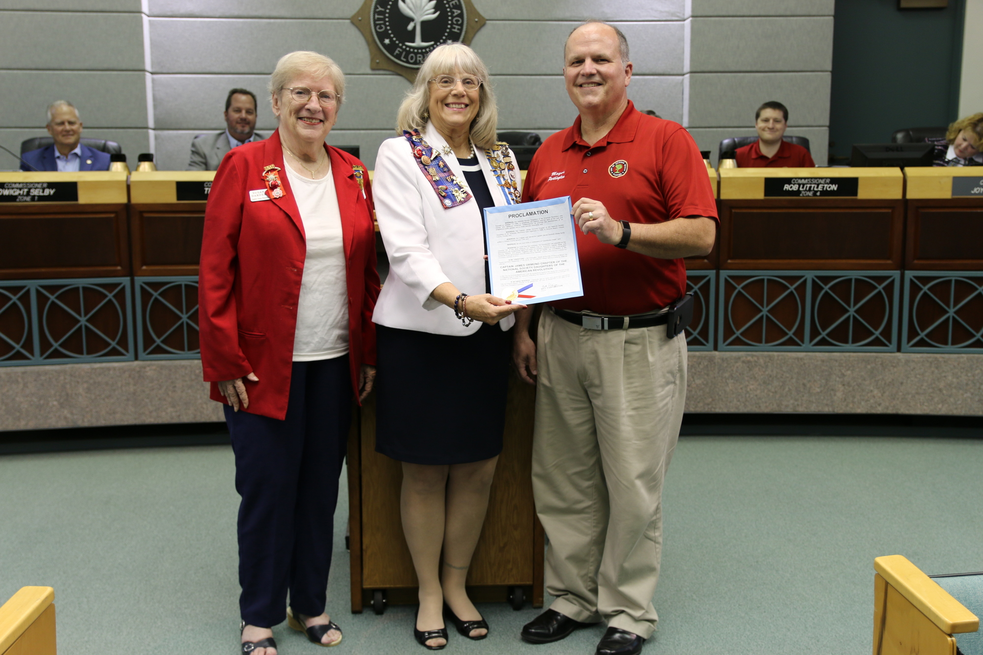 Susan Darden and Dee Clark of the Captain James Ormond chapter of the DAR smile with Ormond Beach Mayor Bill Partington. Photo by Jarleene Almenas