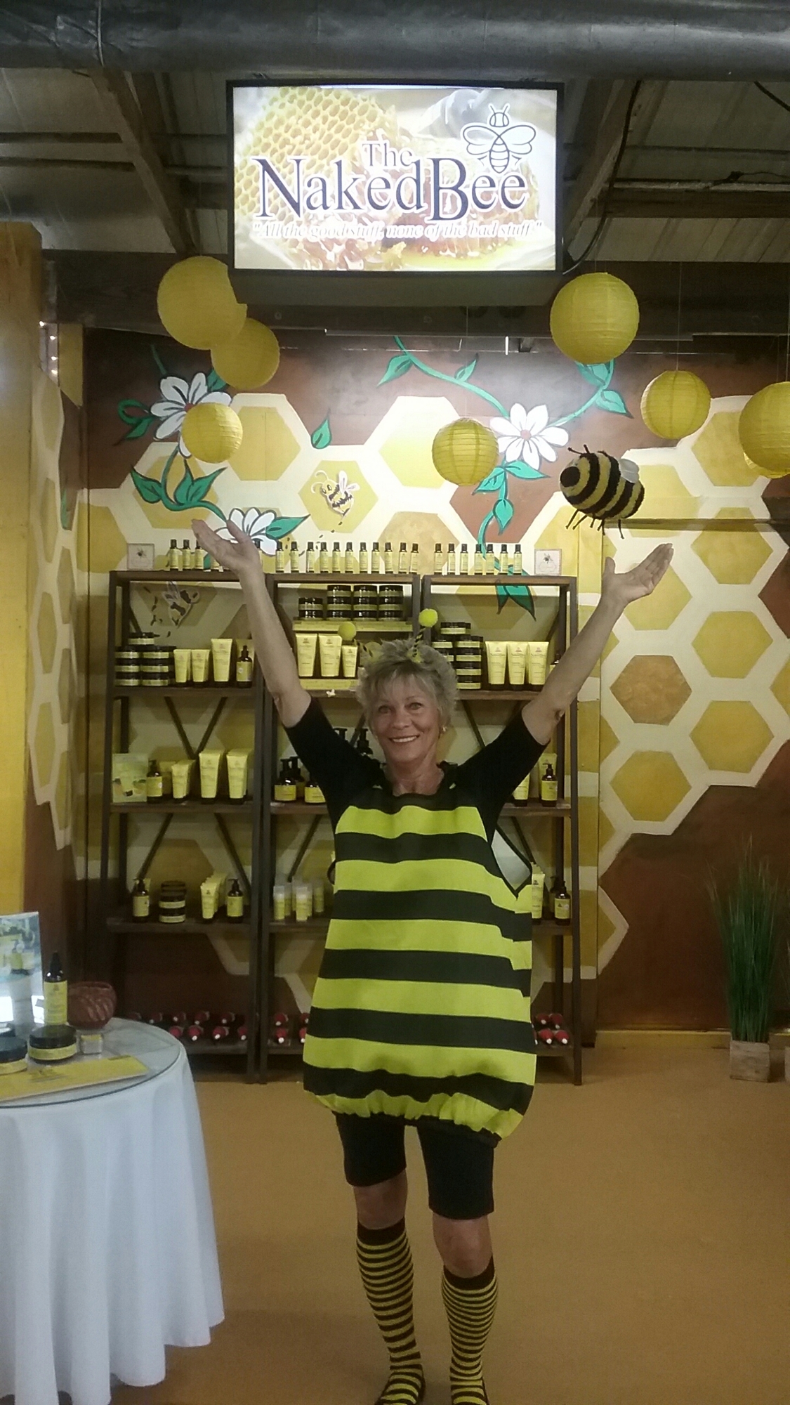 A bee (Diane Robinson) helped celebrate the addition of the Naked Bee line of skin care products at Nina’s Nook at the Daytona Beach Flea Market. Courtesy photo