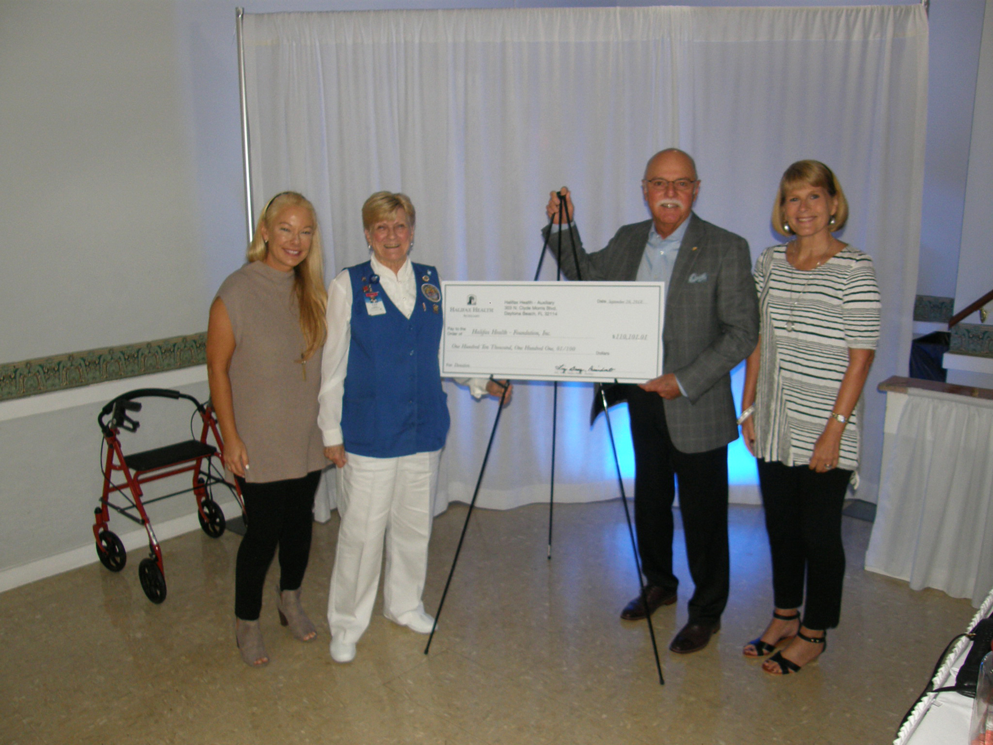 Shown at a check presentation are Halifax Health Human Resources Officer Kimberly Fulcher; Auxiliary Past President Liz Dusz; Foundation Director Joe Petrock; and Halifax Health Communications Officer Ann Martorano. 