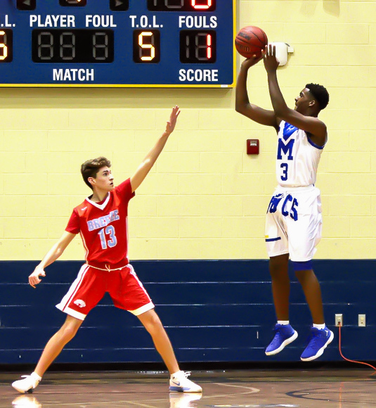 Mainland's Rodney Rhoden shoots a jumper over a Seabreeze defender in a game last season. Photo by Ray Boone