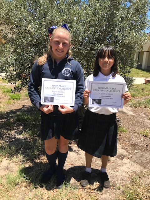 Brylee Shorter and Cynthia Gunn win first and second place respectively in the Creative Minds Writing Contest on May 22. Courtesy photo