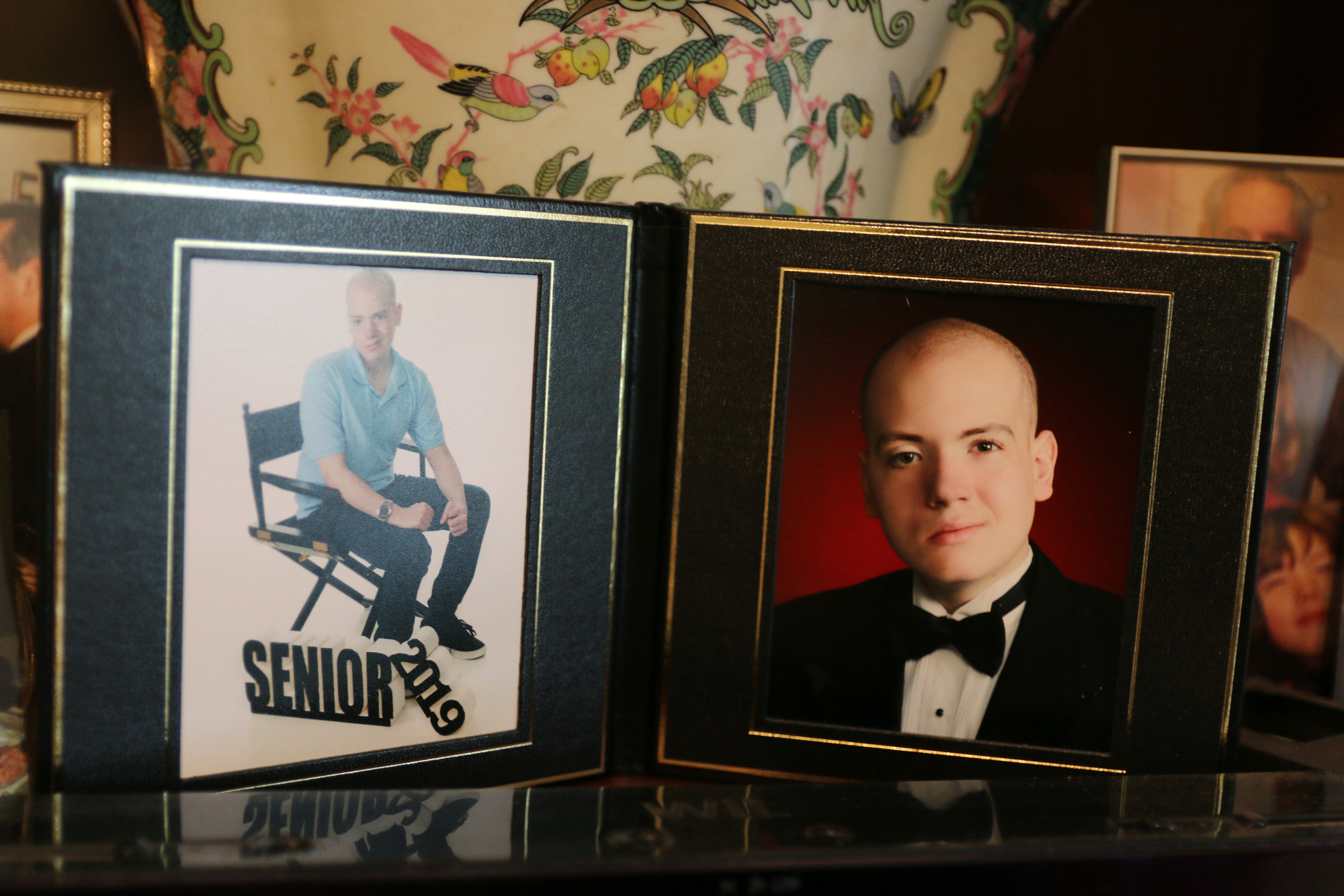 Michael Blavis' senior photos are displayed in his home's living room. Photo by Jarleene Almenas