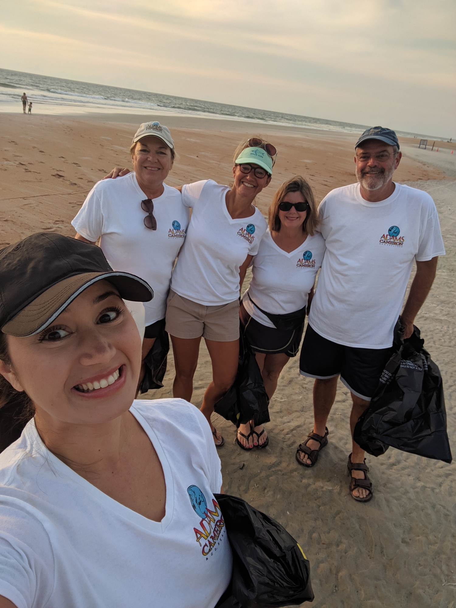 Adams, Cameron and Co., Realtors gathered trash on the beach after July 4. Courtesy photo Chloe Perez