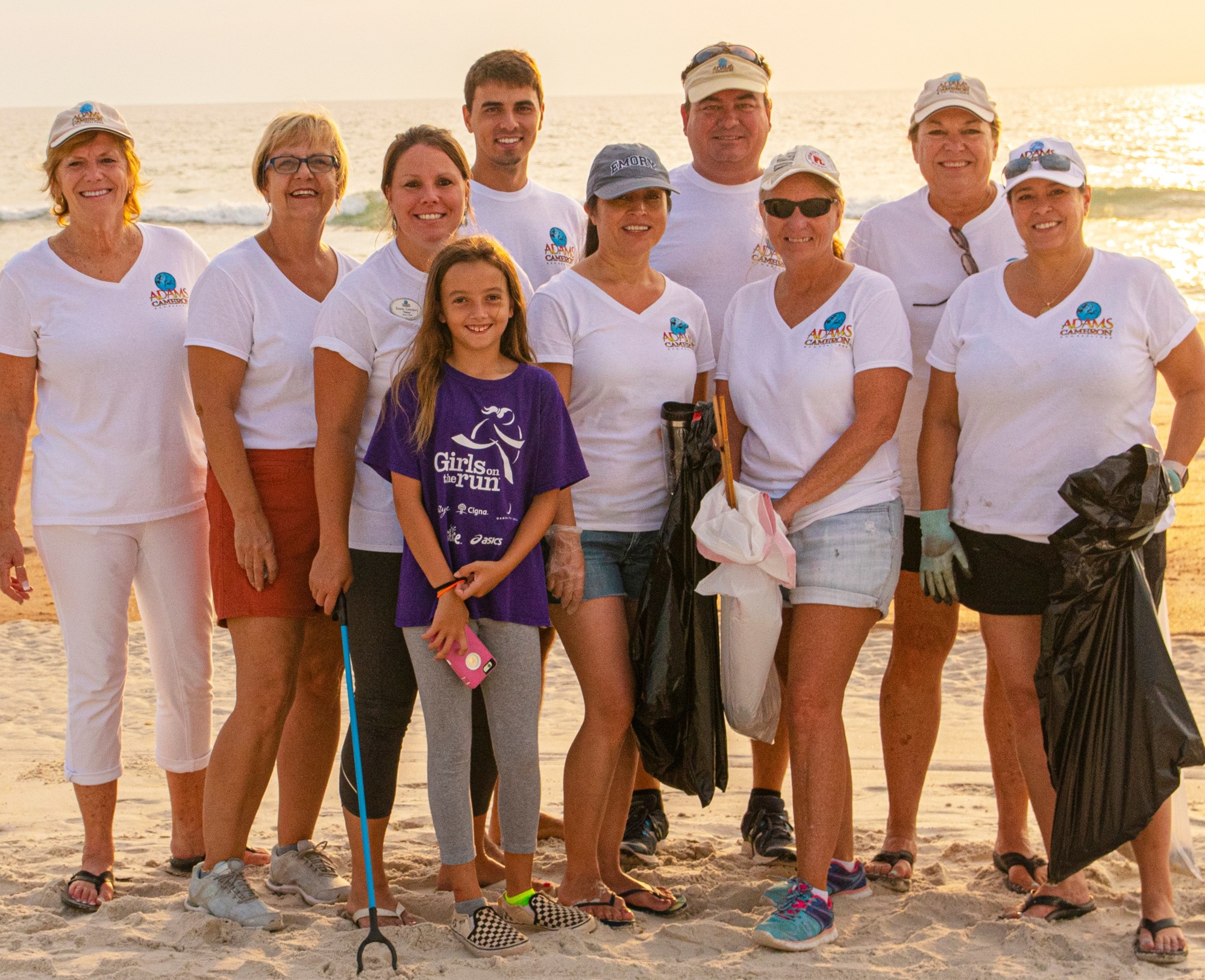 Adams, Cameron and Co., Realtors gathered trash on the beach after July 4. Courtesy photo Newton