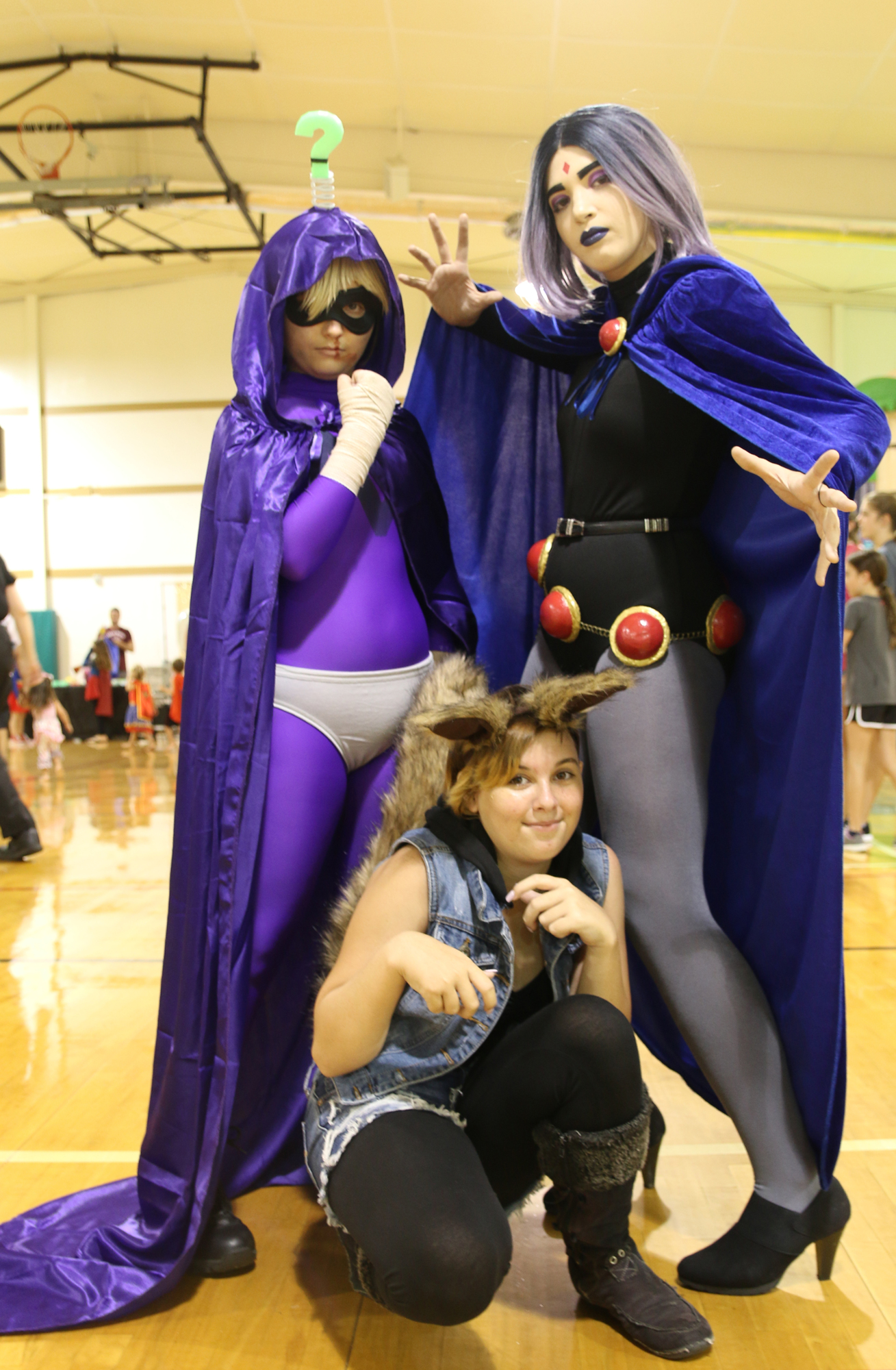 Diane Lancaster, as Mysterion, May Tator as Teen Titan's Raven, and Lakota Gibbs as Squirrel Girl, during the annual National Night Out event on Tuesday, Aug. 6. Photo by Jarleene Almenas