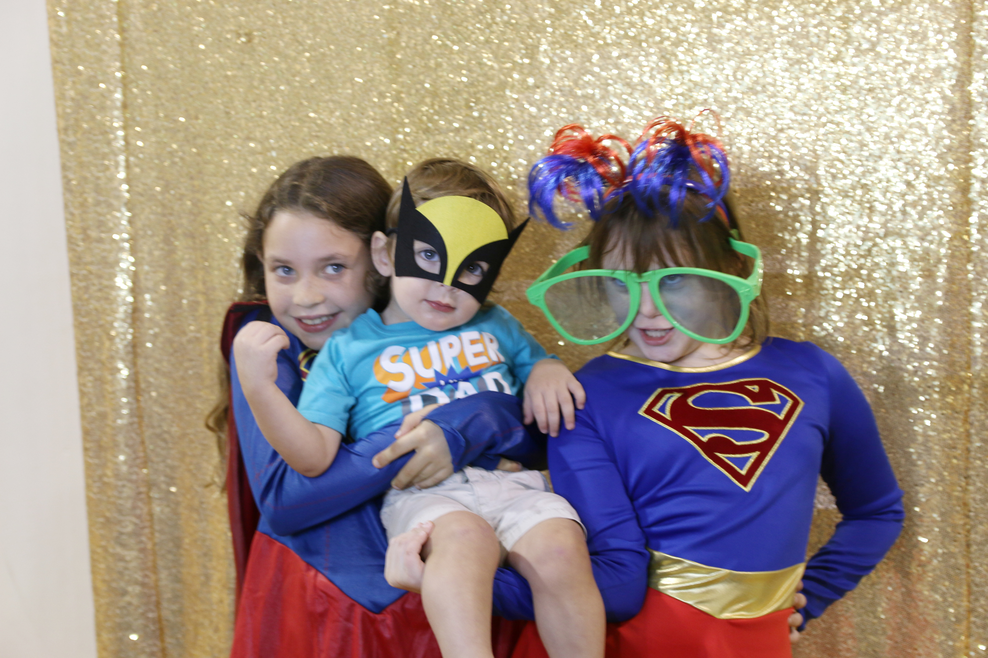 Caylyn Rutkowski, Jay Flaherty and Abby Flaherty take advantage of the photo booth during the annual National Night Out event on Tuesday, Aug. 6. Photo by Jarleene Almenas