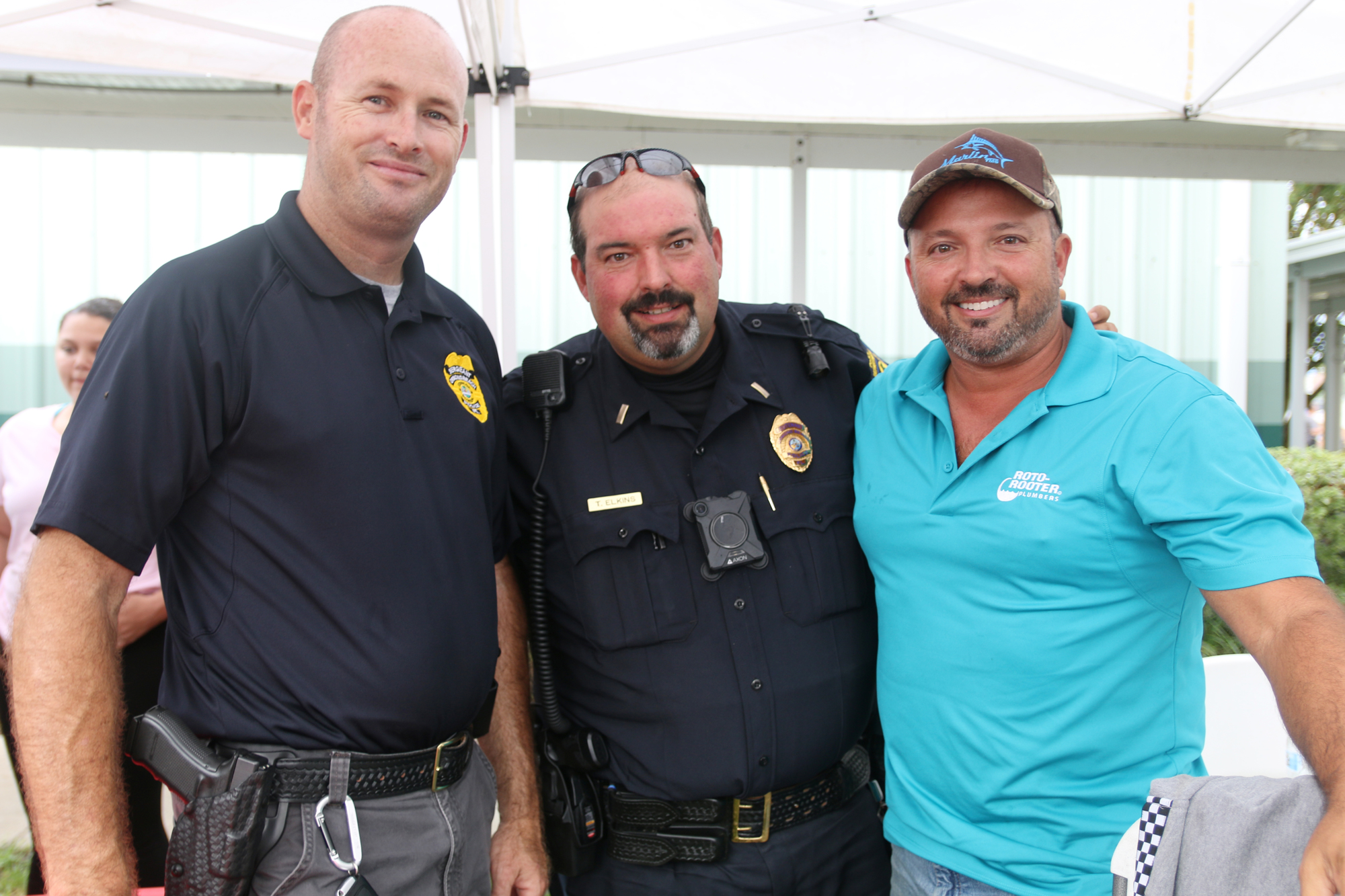 Sgt. Mike Pavelka, Lt. Thomas Elkins and Mike Elkins during the annual National Night Out event on Tuesday, Aug. 6. Photo by Jarleene Almenas