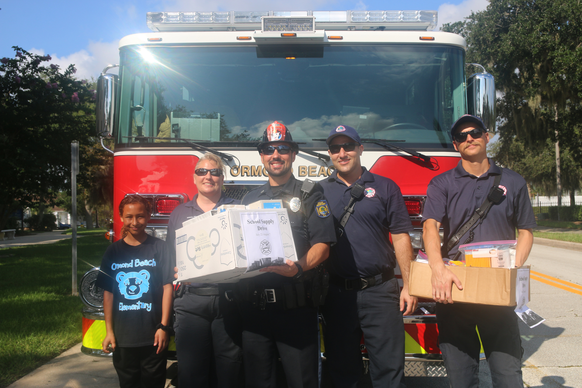 An Ormond Beach Elementary student, firefighter Tabitha Wu, Ormond Beach Police Officer Stephen Brugone,  firefighters Kevin Holt and Ethan Wilson. Photo by Jarleene Almenas