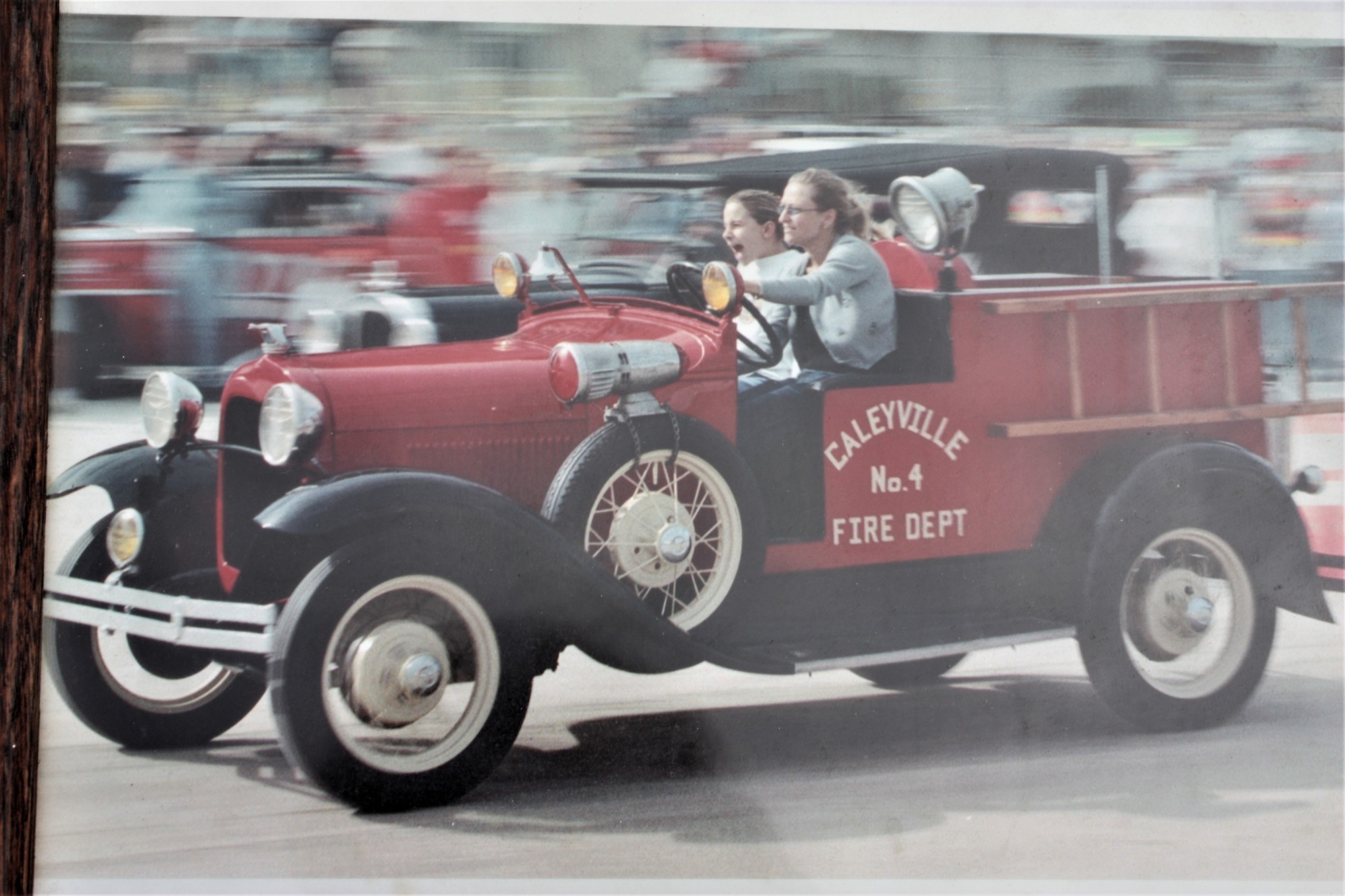 Caley Hayes rides in a firetruck built for her by her grandfather in 2000. Driving is her aunt, Kellie Pike. Courtesy photo