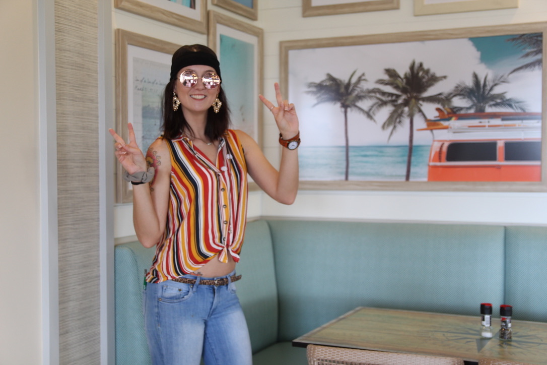 The staff at Latitude in Margaritaville got into the spirit of the day with peace signs and groovy get up. Photo by Tanya Russo