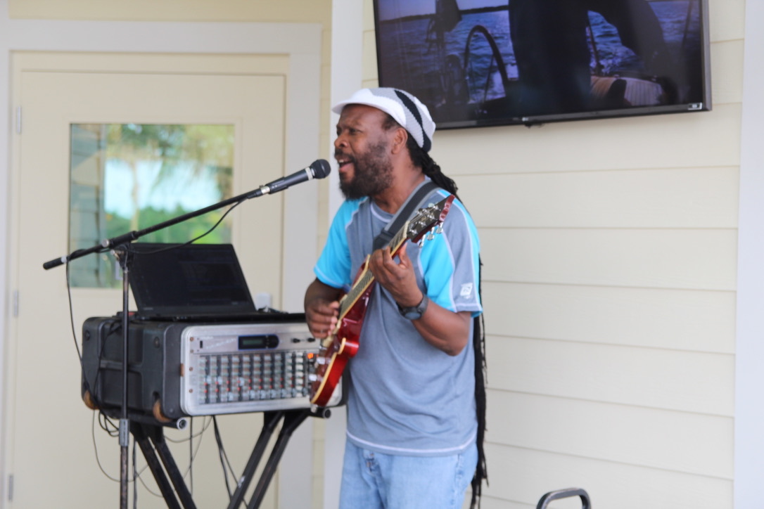 Freddie Grant sings Caribbean tunes and wails on the guitar for the Margaritaville crowd. Photo by Tanya Russo