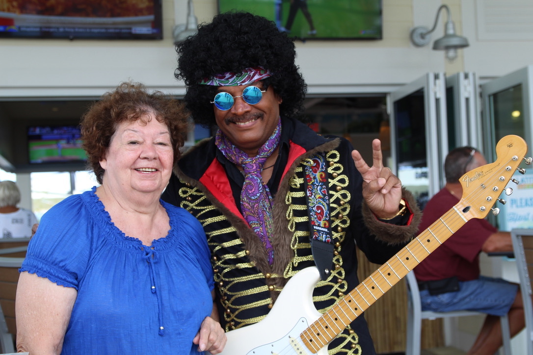 Port Orange resident Judy Gerber enjoys the action at Margueritaville while she poses with Jimmy Hendrix. Photo by Tanya Russo