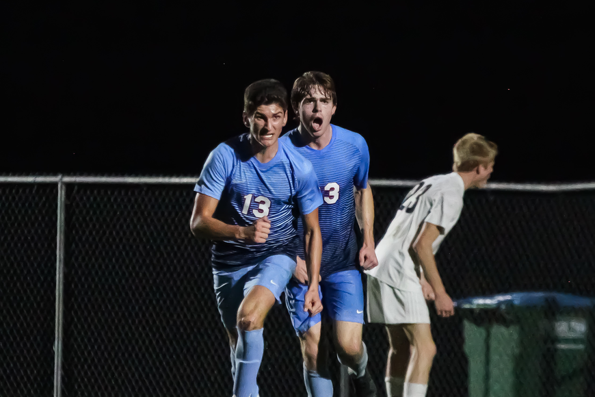 Michel Hanna (No. 13) celebrates with teammate Will Crotty after scoring a goal against Ponte Vedra.