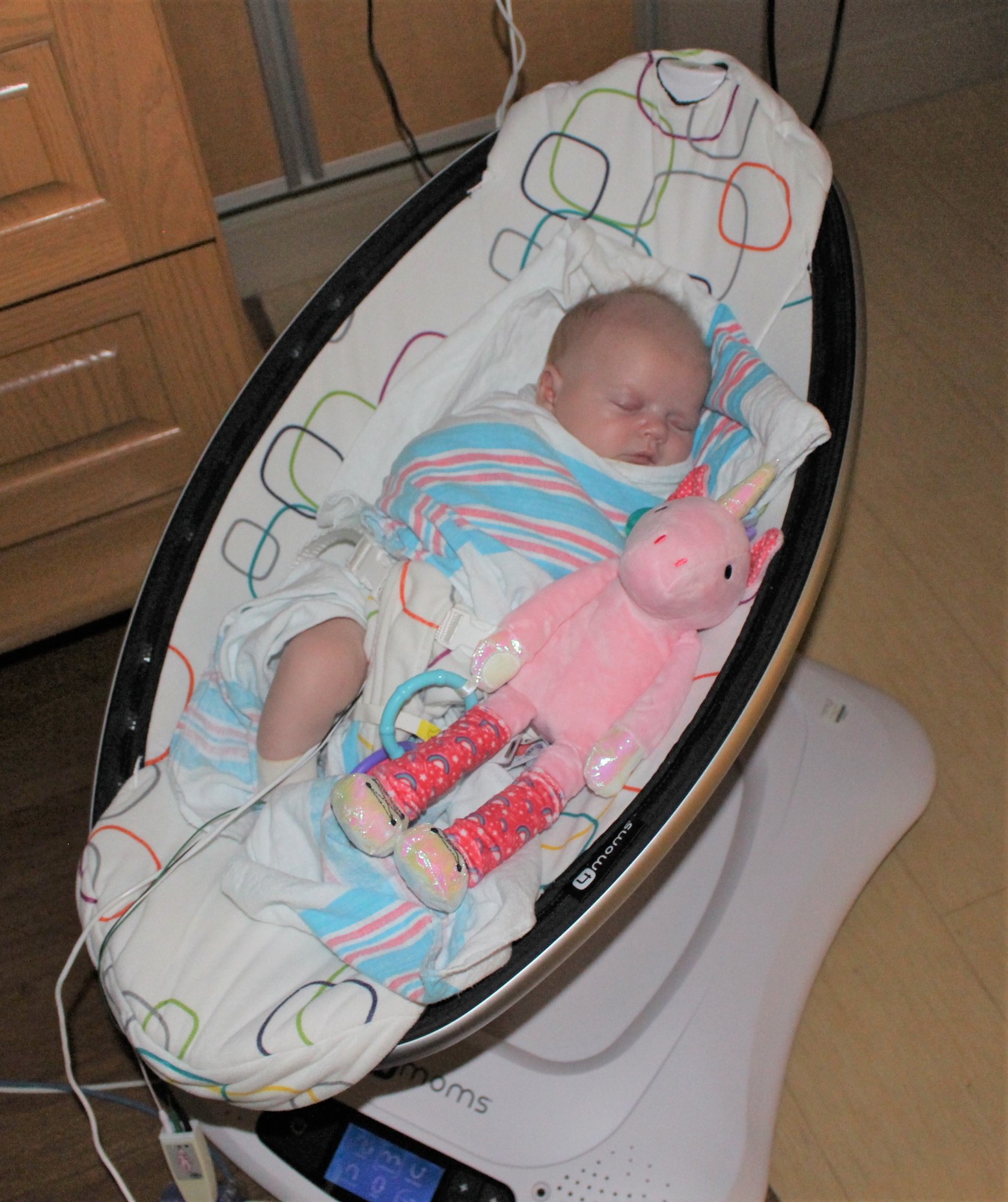 Raylynn Thomas sleeps next to a donated Scentsy buddy, a scented, stuffed animal toy, at AdventHealth Daytona Beach. Courtesy photo