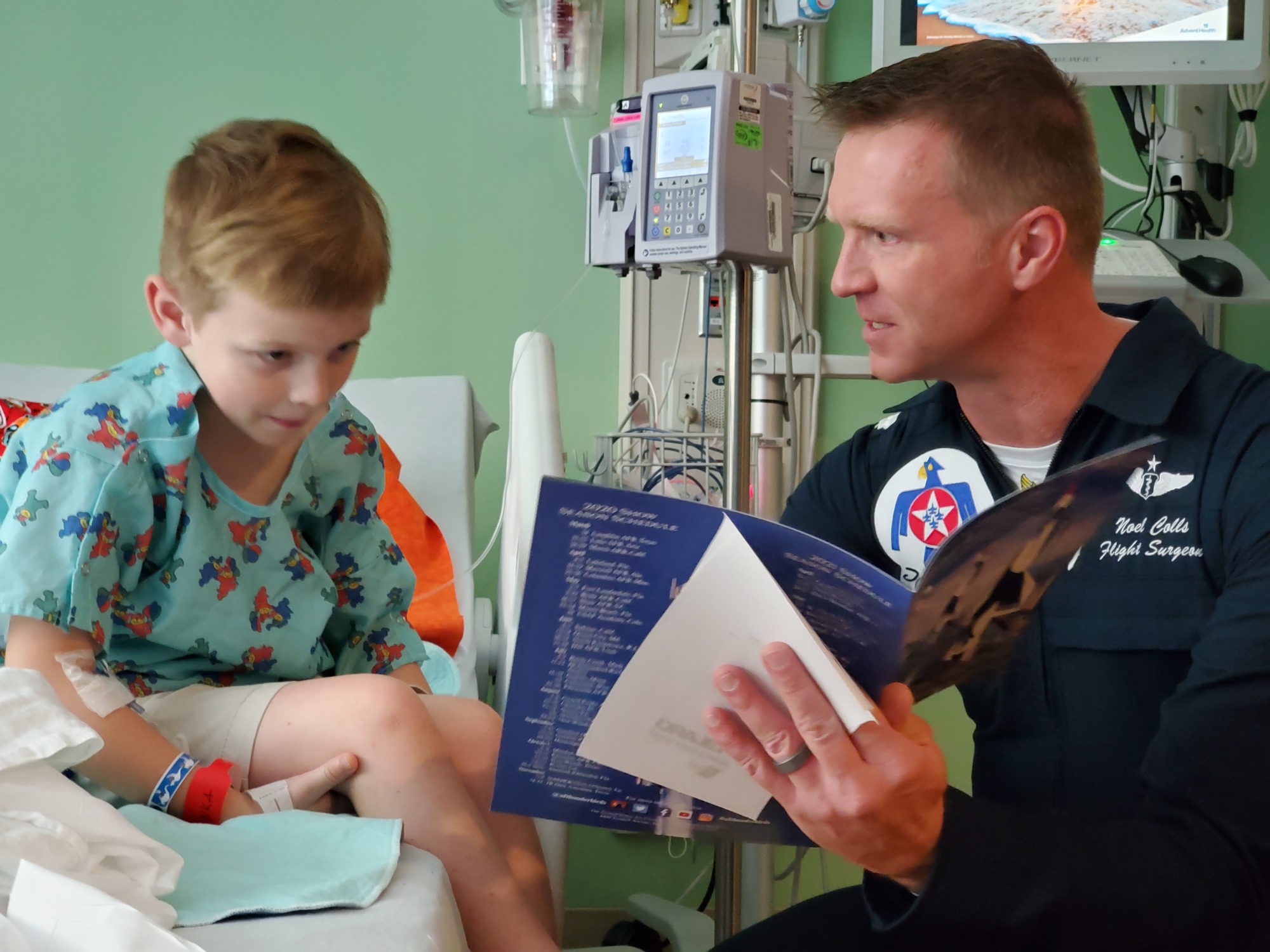 Lt. Col. Dr. Noel Colls, flight surgeon, talks to Alexander Arnold, 6, of Bunnell during a visit by the U.S. Air Force Thunderbirds to the AdventHealth Daytona Beach pediatric unit. Courtesy photo