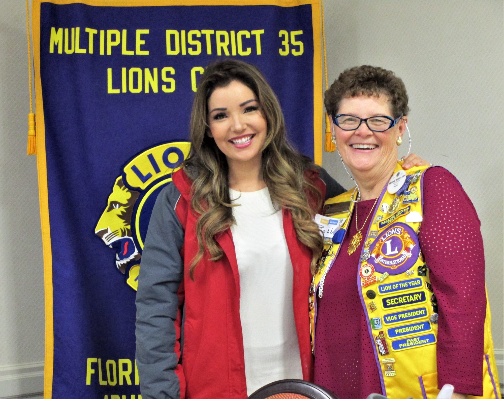 WKMG News Anchor Lisa Bell with Lion Bobbie Cheh. Courtesy photo