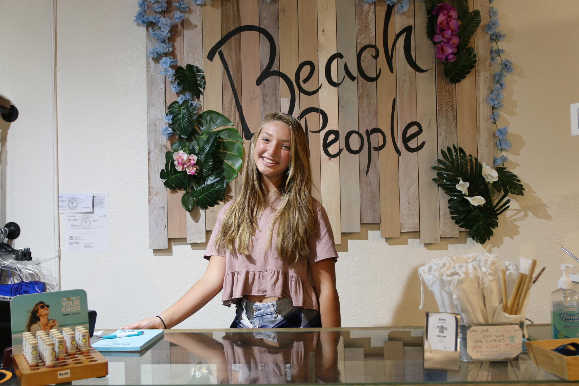 Amelia Canfield, employee at Beach People Boutique, which opened in June. Photo by Jarleene Almenas