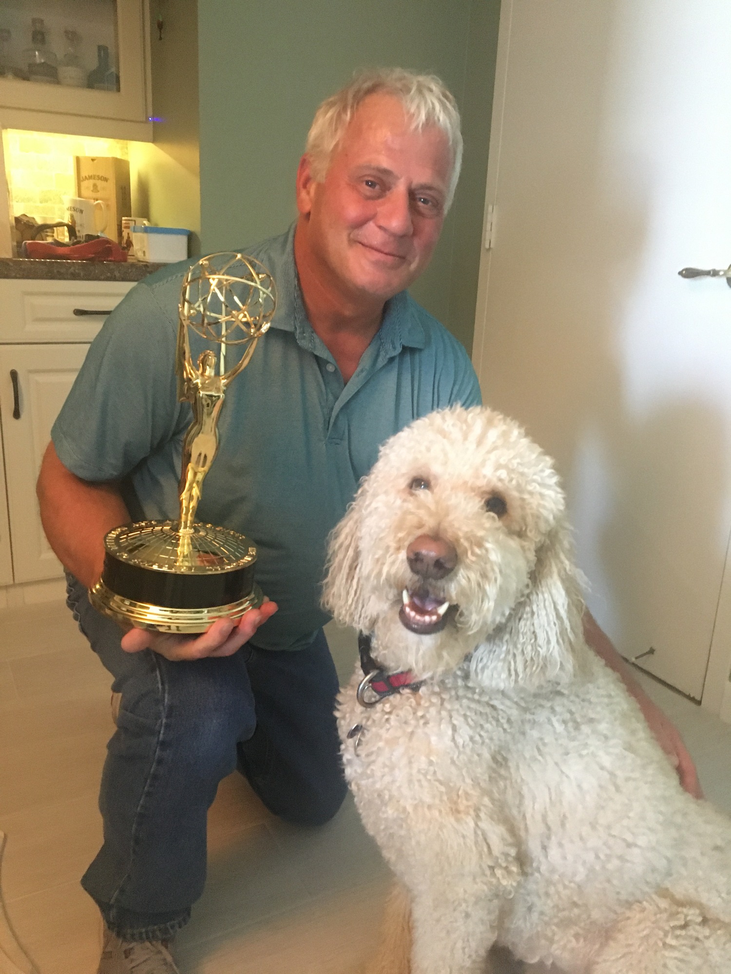 Patrick Thornton shows off his Emmy alongside his dog Dude. Courtesy photo