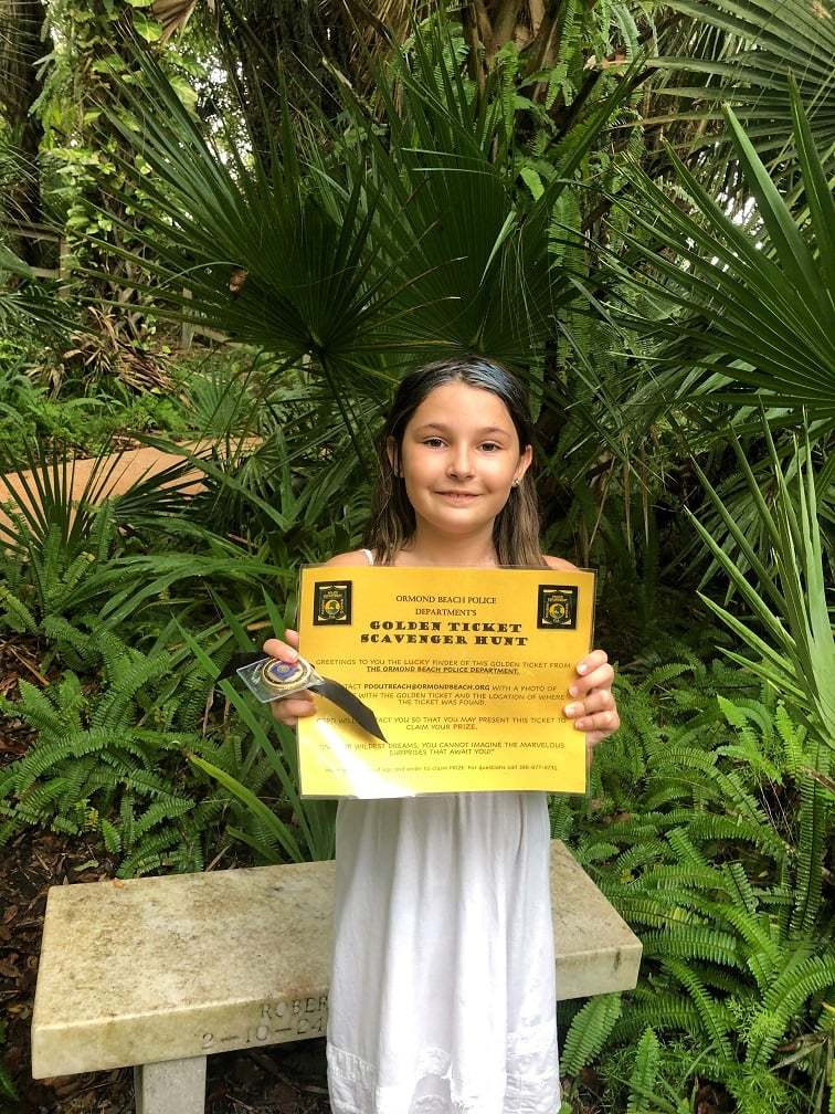 Madison Lonnecker found one of OBPD's golden tickets at the Ormond Memorial Art Museum gardens. Courtesy photo