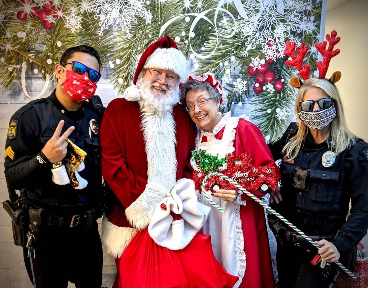 Ormond Beach Police Cpl. Jay Brennan, Santa and Mrs. Claus, and Officer Danielle Henderson. Photo courtesy of OBPD's Facebook page