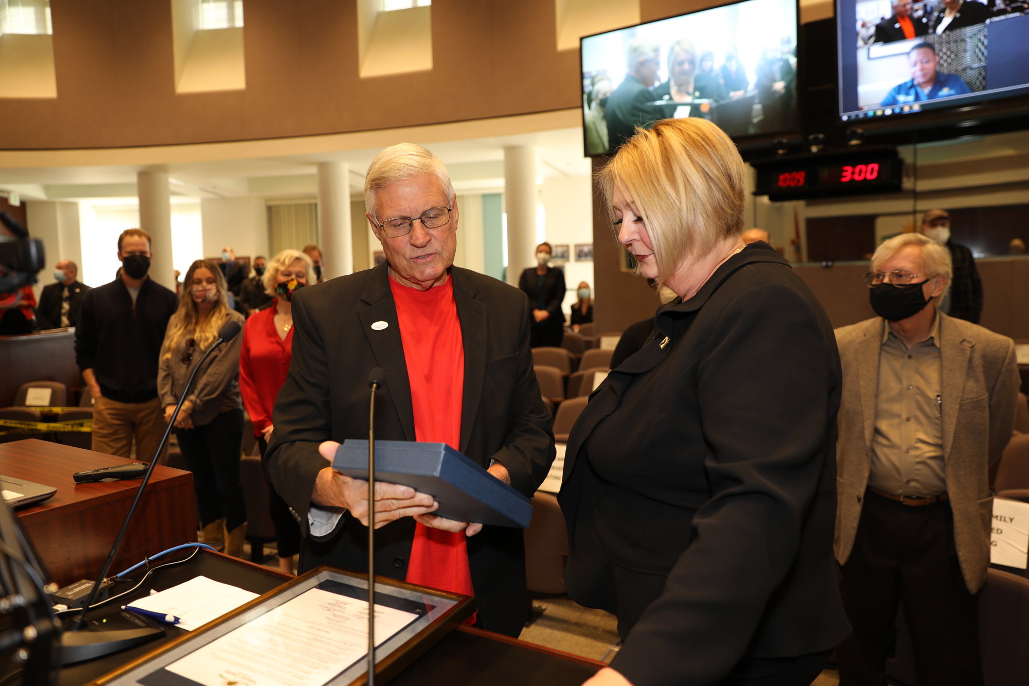 Councilman Fred Lowry reads the proclamation to Councilwoman Deb Denys. Photo courtesy of Volusia County Government