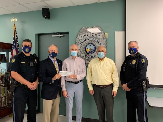 Capt. Chris Roos; Dwight Selby, city commissioner and president of the Ormond Beach Police Foundation; David Neubauer and Charles Lichtigman, owners of Granada Plaza; and Police Chief Jesse Godfrey. Courtesy photo