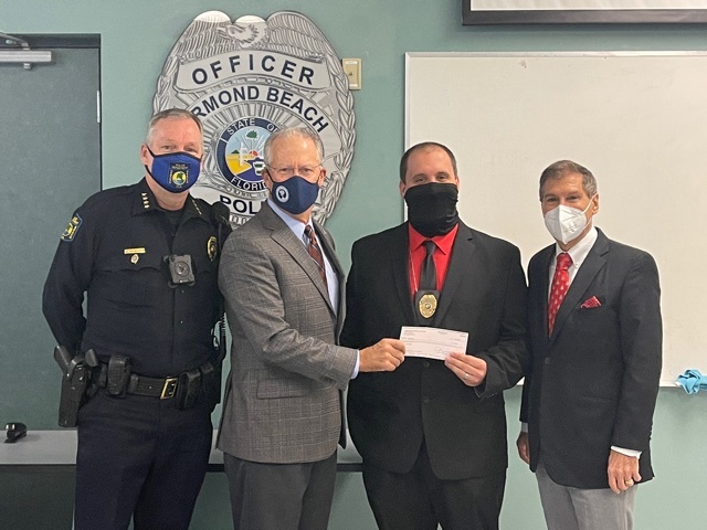 Ormond Beach Police Chief Jesse Godfrey, City Commissioner Dwight Selby, Detective Ryan Mihalko and School Board Member Carl Persis. Courtesy photo