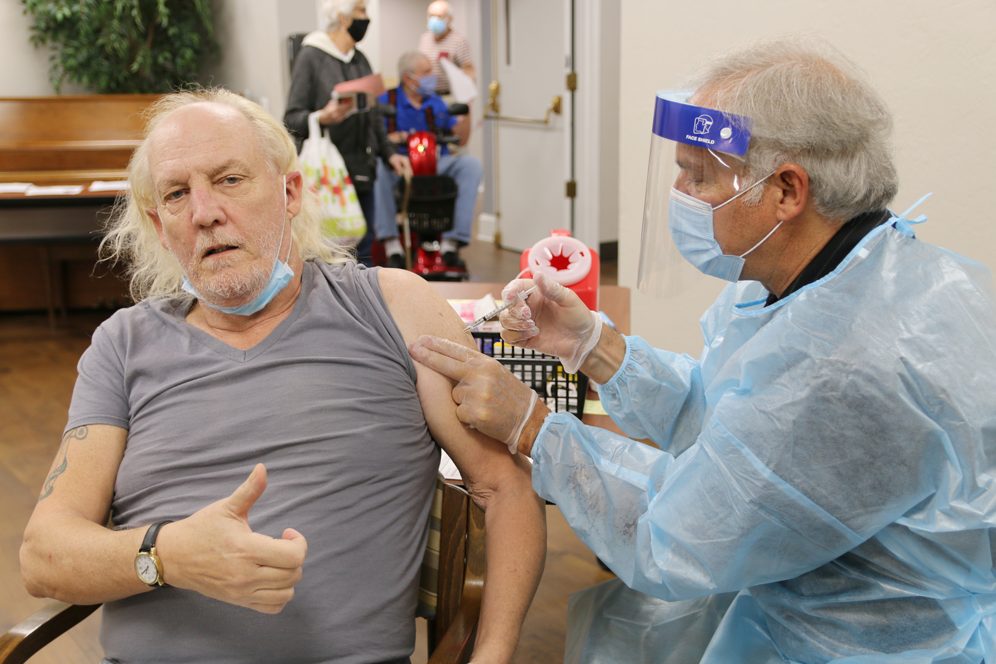 Michael Jr. Driskill, a resident at Ormond in the Pines, gives a thumbs-up as he receives the COVID-19 vaccine. Photo by Jarleene Almenas