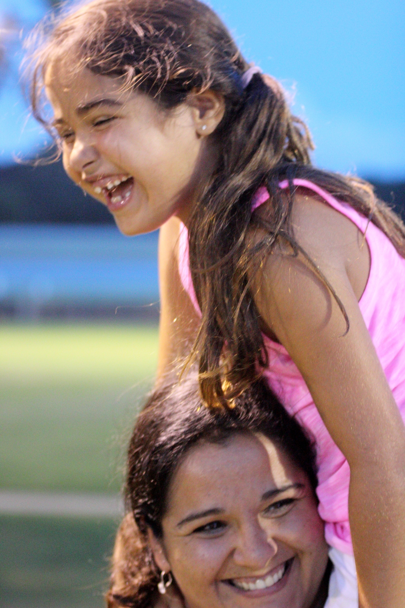 Annabelle  cheers on the All-stars on her mother, Christina's, shoulders. Photo by Jeff Dawsey