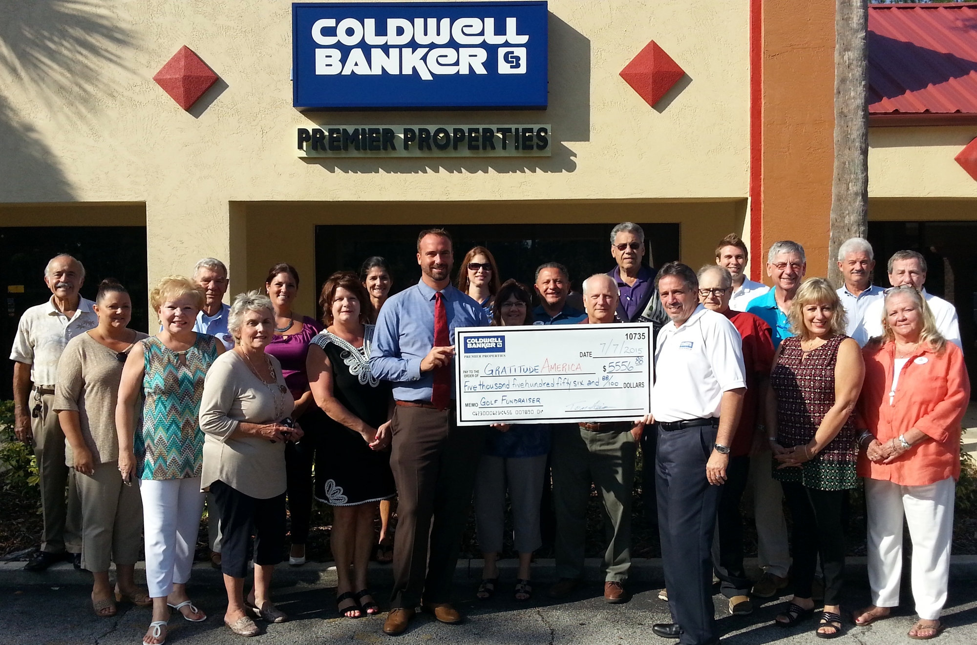 Coldwell Banker presents GratitudeAmerica with a check for over $5,500.  Photo by Jeff Dawsey