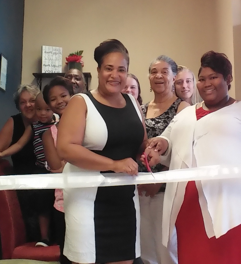 Elva Thompson and Amber Selvey cut the ribbon to their new business location. Courtesy photos