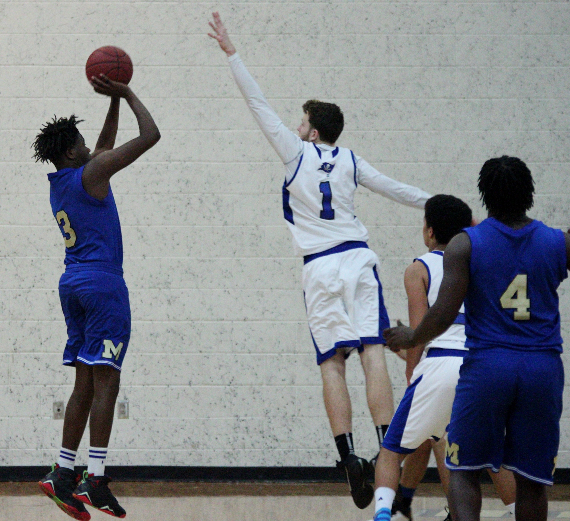 Aaron Goodwin goes up and block a Mainland player's shot. Photos by Jeff Dawsey