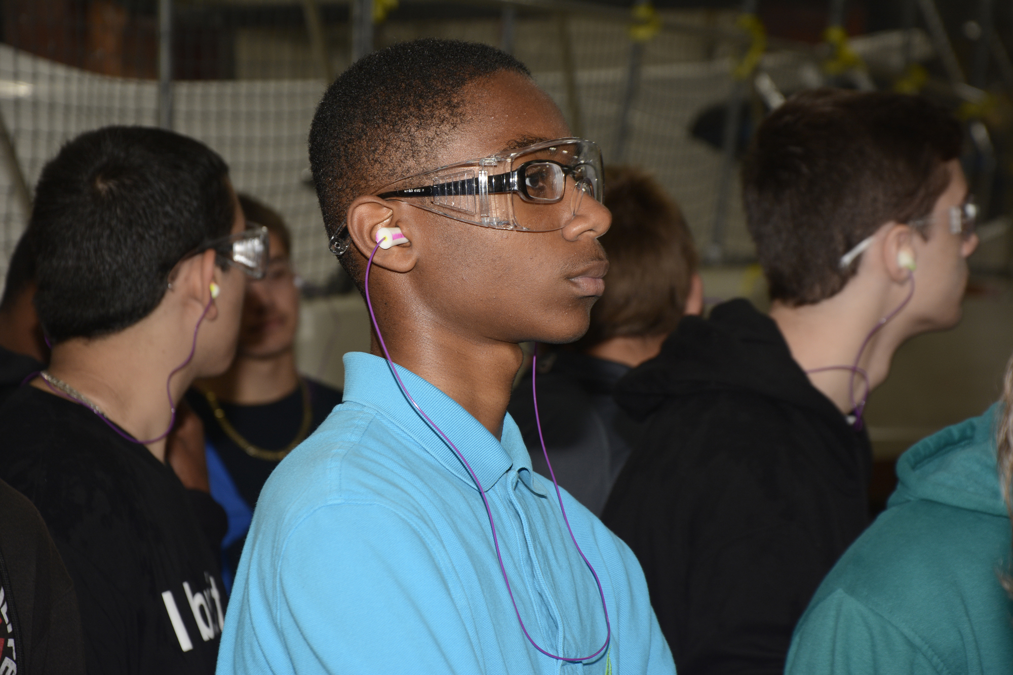 Lavadus Davis, a freshman of FPC, listens intently to SeaRay tour guide Chris Lamb, as he explains the inner-workings of the manufacturing facility.