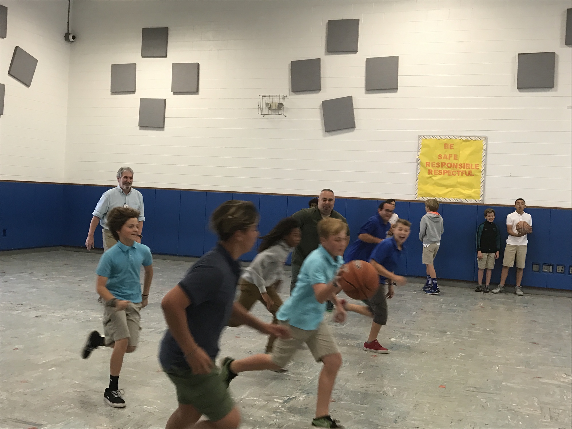 Old Kings teachers and staff take on fifth- and sixth-graders on the basketball court. Courtesy photo
