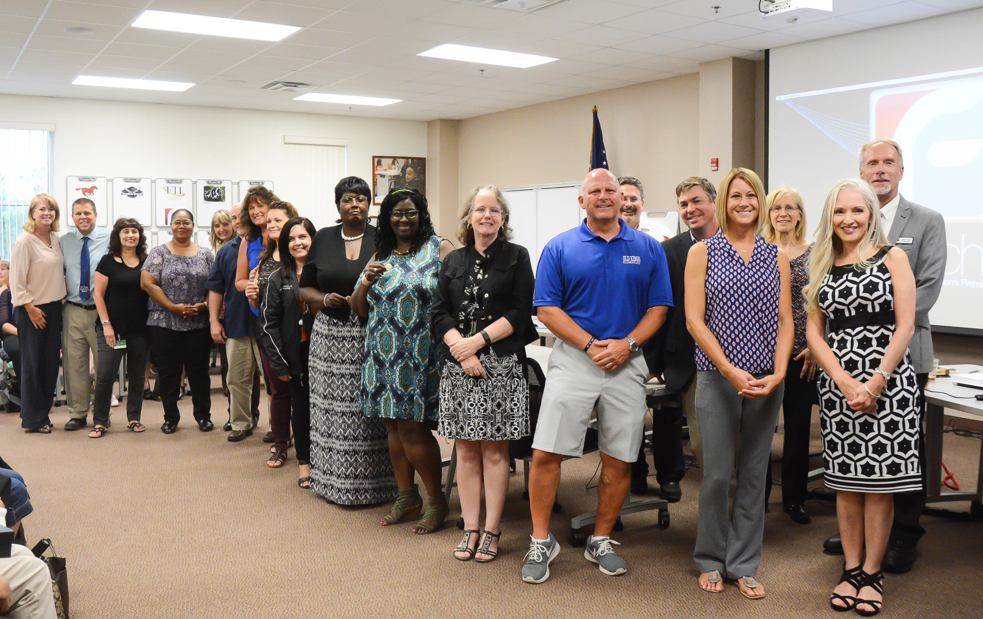 Flagler School Board members stand with a group of county employees recognized for their years of service. Photo by Paige Wilson